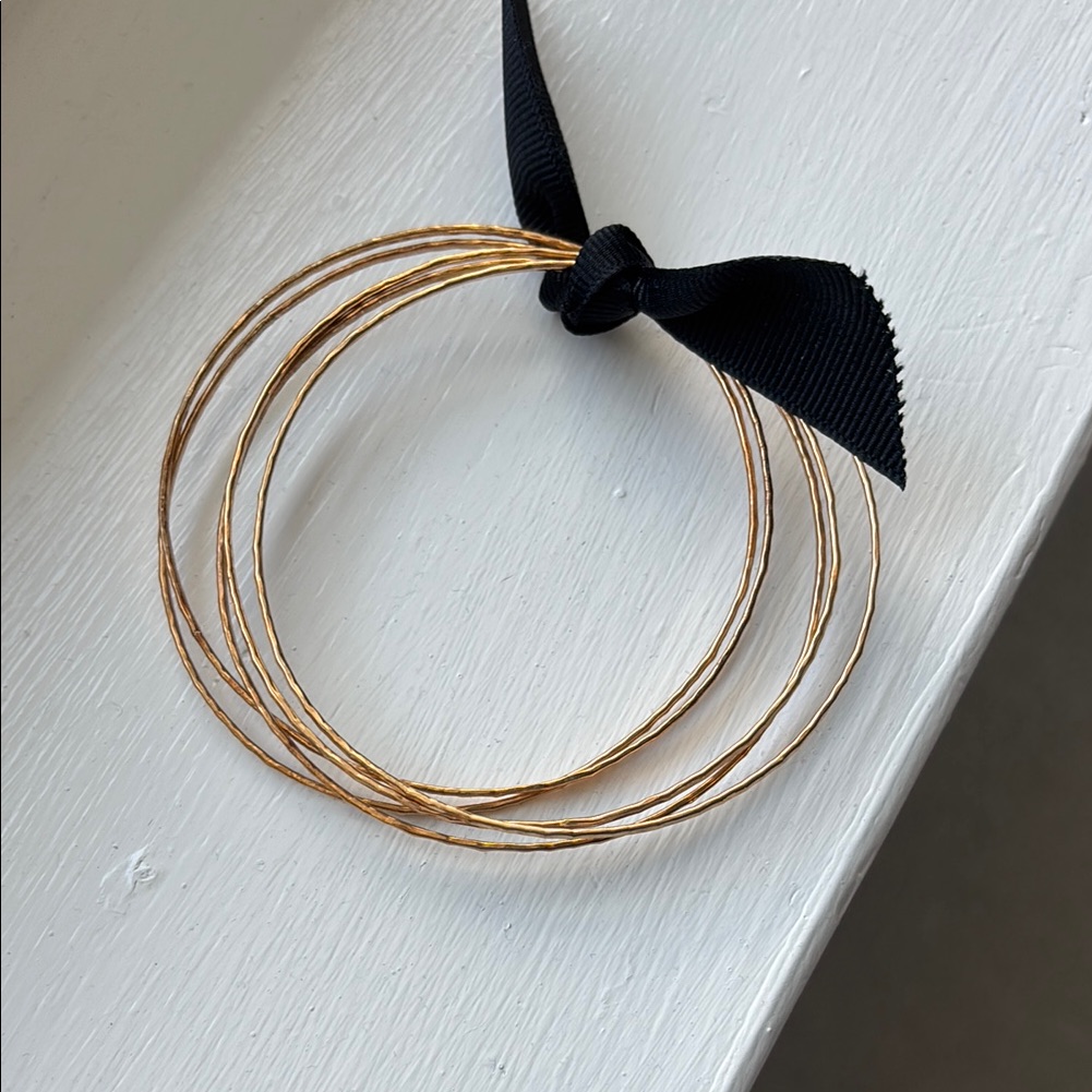 Gold Wire Bangles With Black Bow